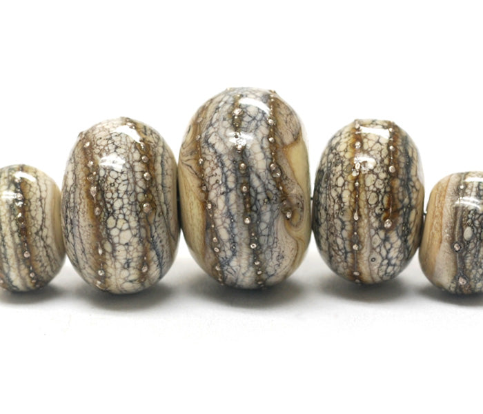 10306011 - Five Graduated Dark Ivory w/Silver Rondelle Beads