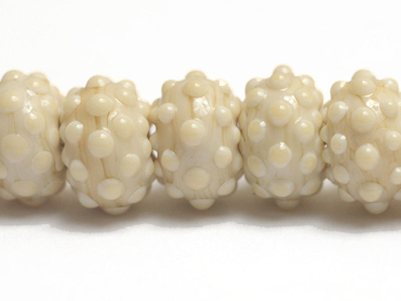 10306101 - Seven Cream Rondelle Beads
