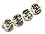 10306212 - Four Musical Notes Lentil Beads