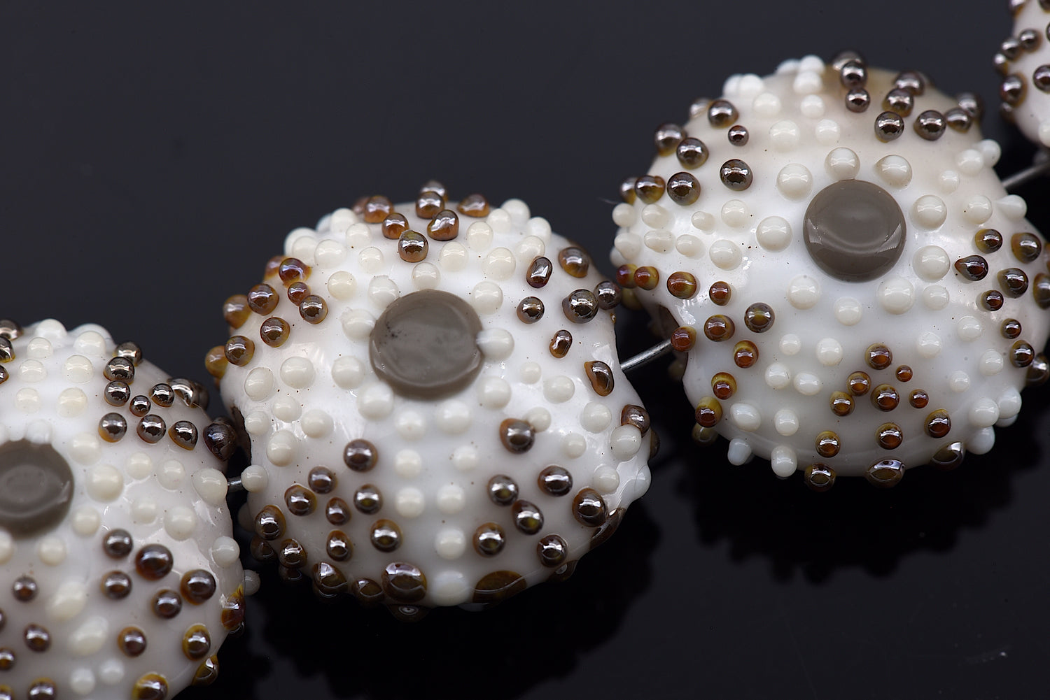 10306612 - Four Ivory Sea Urchin Lentil Beads