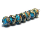 10405501 - Seven Amber Ocean Rondelle Beads