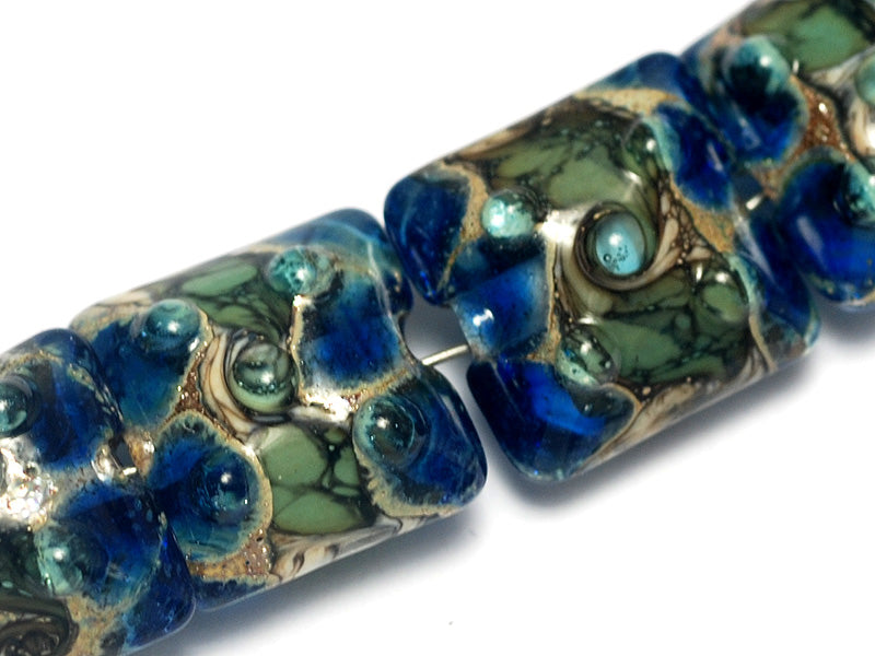 10406514 - Four Deep Blue Ocean Pillow Beads