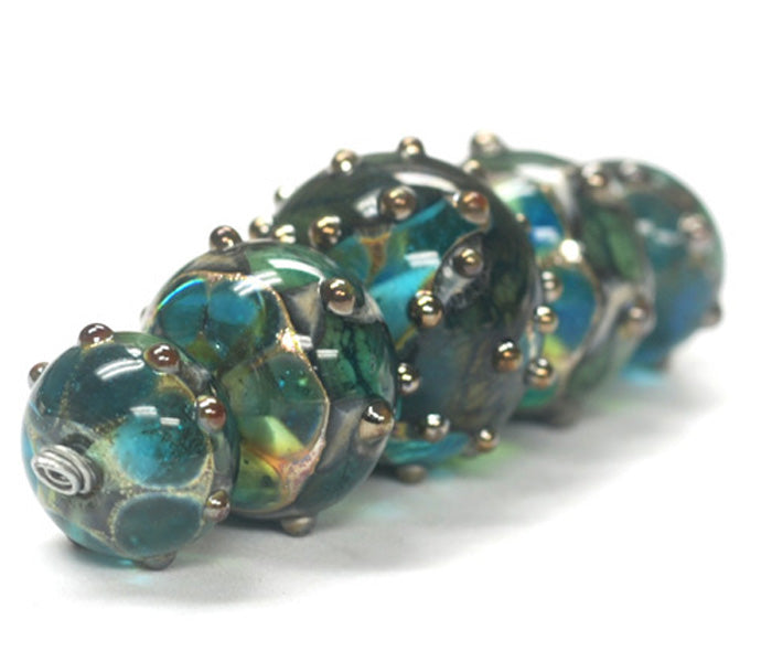 10406711 - Five Graduated Ocean Blue w/Silver Foil Beads