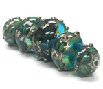 10406711 - Five Graduated Ocean Blue w/Silver Foil Beads