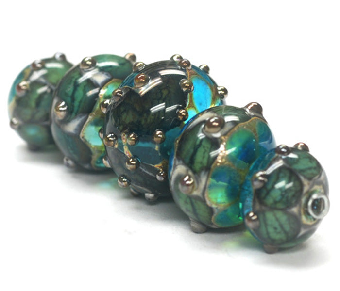 10406711 - Five Graduated Ocean Blue w/Silver Foil Beads