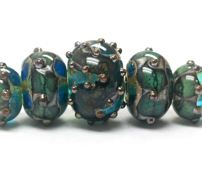 10406711 - Five Graduated Ocean Blue w/Silver Foil Beads