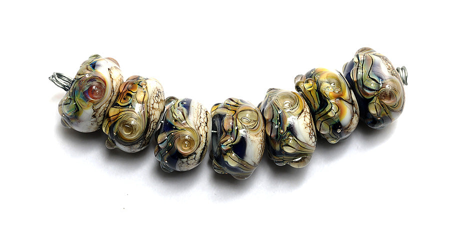 10407001 - Seven Transparent Ink Blue Free Style Rondelle Beads