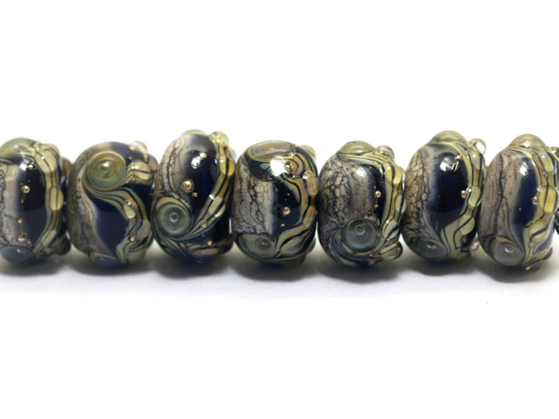10407001 - Seven Transparent Ink Blue Free Style Rondelle Beads