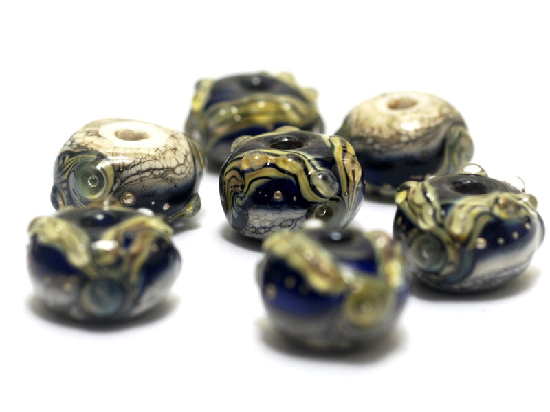 10407001 - Seven Transparent Ink Blue Free Style Rondelle Beads