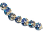 10407102 - Seven Transparent Blue Seashell Lentil Beads