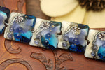 10407104 - Seven Transparent Blue Seashell Pillow Beads