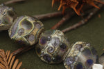 10407302 - Seven Black w/Ink Blue Silver Foil Lentil Beads