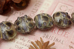 10407302 - Seven Black w/Ink Blue Silver Foil Lentil Beads