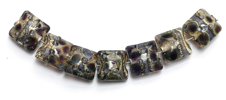 10407304 - Seven Black w/Purple Silver Foil Pillow Beads