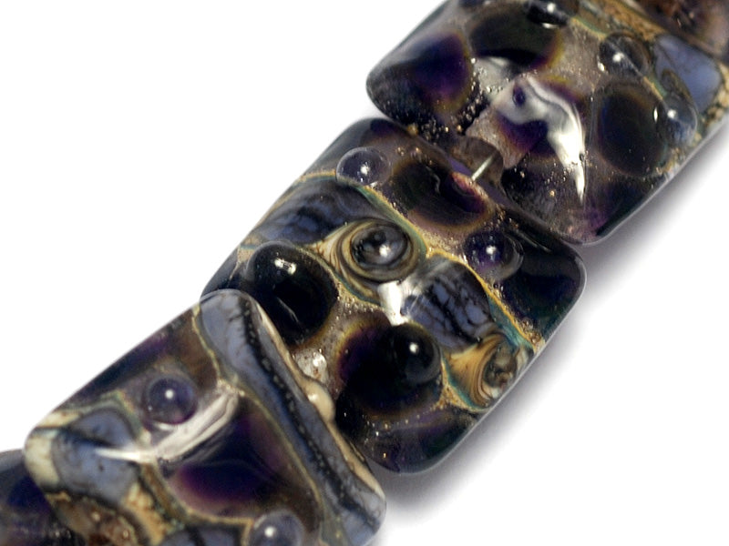10407304 - Seven Black w/Purple Silver Foil Pillow Beads