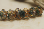 10409401 - Seven Blue & Orange Boro Rondelle Beads