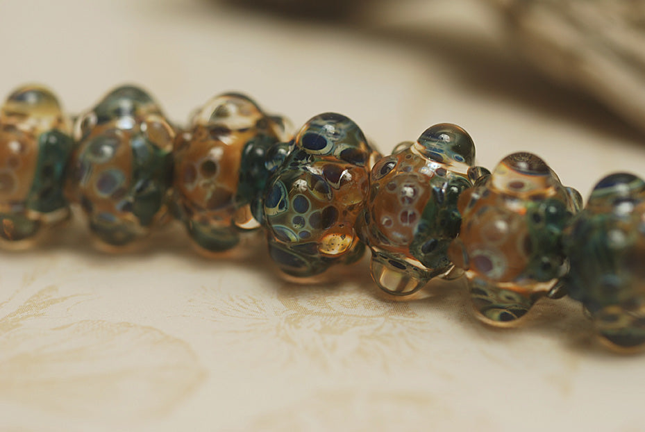 10409401 - Seven Blue & Orange Boro Rondelle Beads