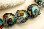 10409902 - Seven Aqua Treasure Lentil Beads