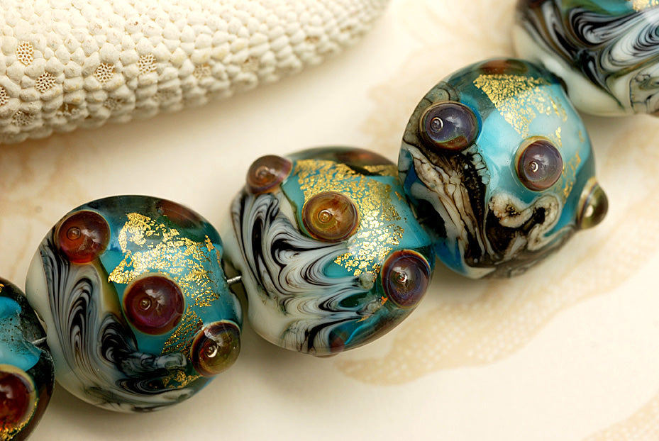 10409902 - Seven Aqua Treasure Lentil Beads