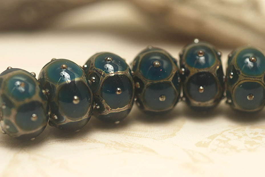 10410301 - Seven Teal w/Metal Dots Rondelle Beads