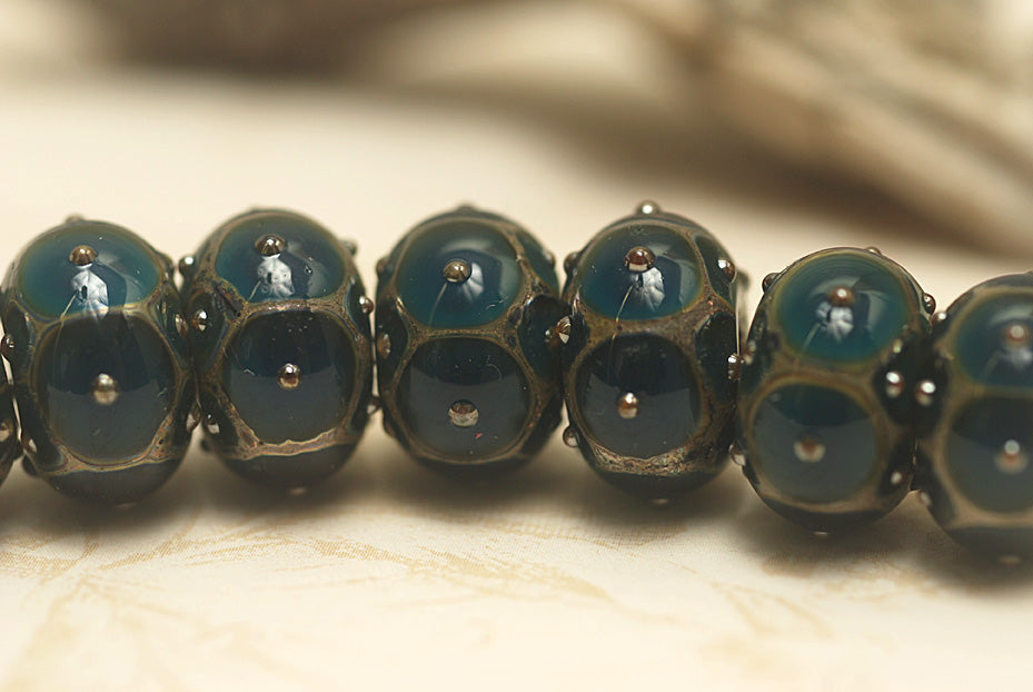10410301 - Seven Teal w/Metal Dots Rondelle Beads
