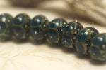 10410301 - Seven Teal w/Metal Dots Rondelle Beads