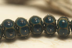 10410301 - Seven Teal w/Metal Dots Rondelle Beads