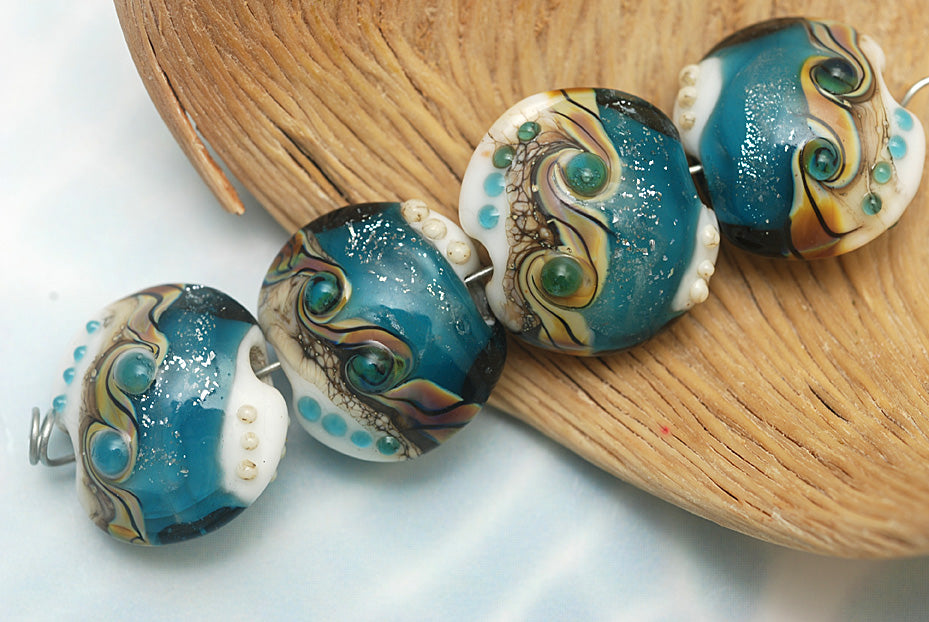 10410912 - Four Teal Stardust Lentil Beads