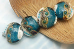 10410912 - Four Teal Stardust Lentil Beads