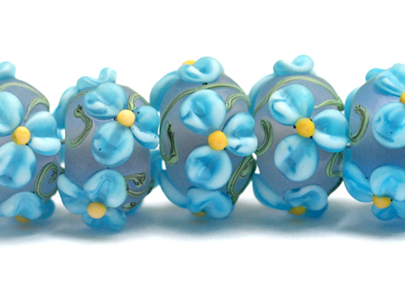 10411101 - Seven Blue Floral on Frosted Glass Rondelle Beads