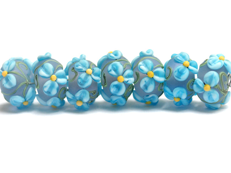 10411101 - Seven Blue Floral on Frosted Glass Rondelle Beads