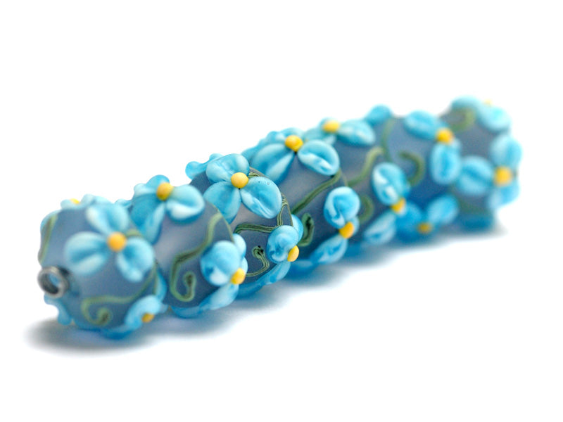 10411101 - Seven Blue Floral on Frosted Glass Rondelle Beads