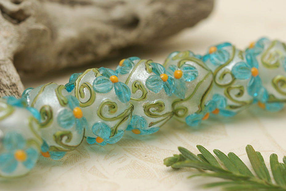 10411301 - Seven Maya Blue Flower Rondelle Beads