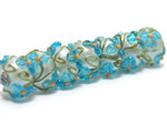 10411301 - Seven Maya Blue Flower Rondelle Beads