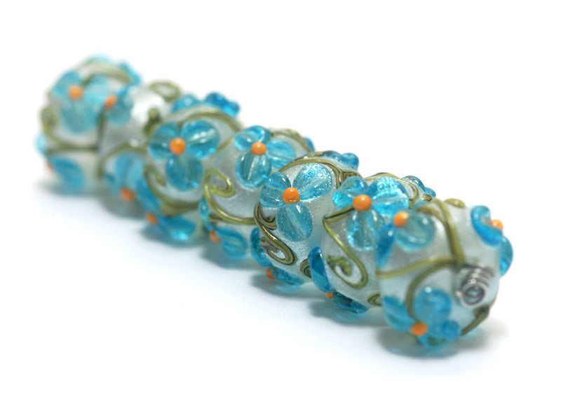 10411301 - Seven Maya Blue Flower Rondelle Beads
