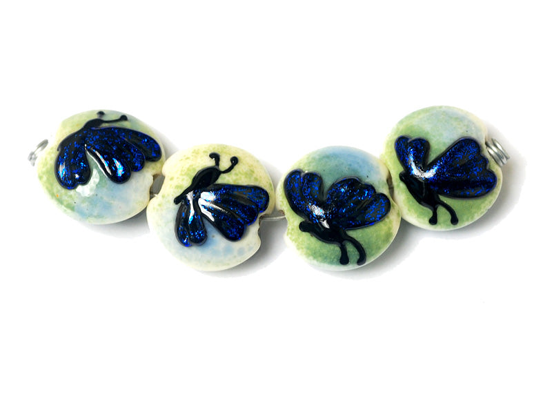 10412912 - Four Blue Sparkle Garden Butterfly Lentil Beads