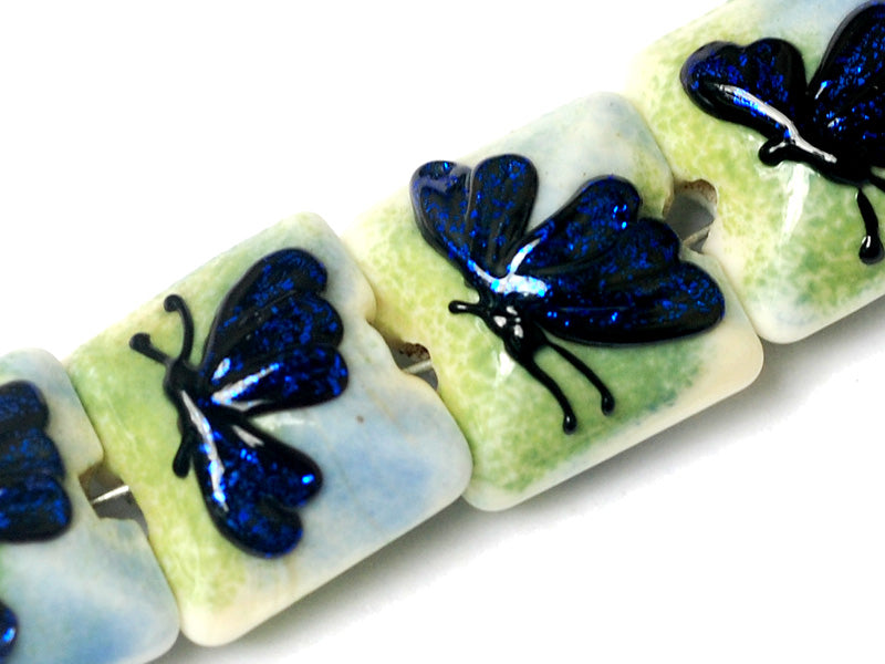 10412914 - Four Blue Sparkle Garden Butterfly Pillow Beads