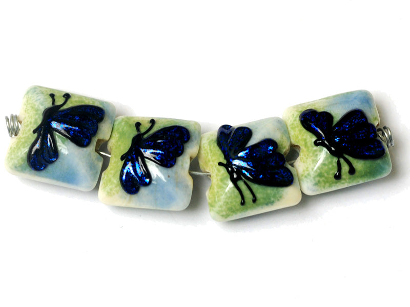 10412914 - Four Blue Sparkle Garden Butterfly Pillow Beads
