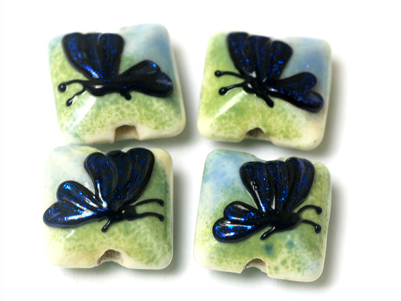 10412914 - Four Blue Sparkle Garden Butterfly Pillow Beads