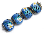 10414212 - Four Arctic Blue Florals Lentil Beads