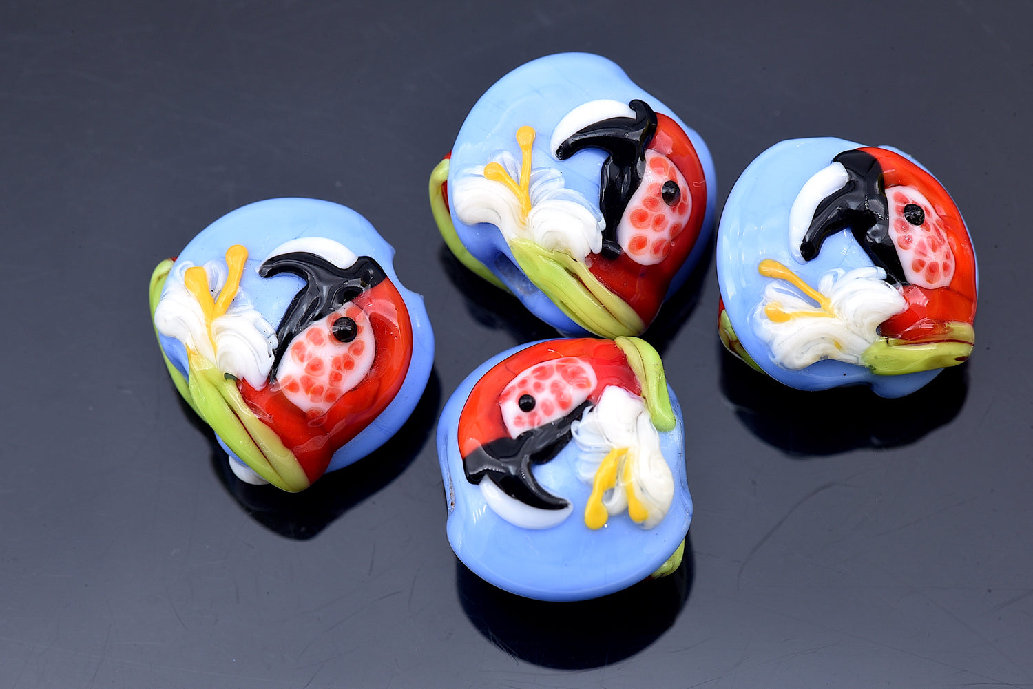 10415212 - Four Red Parrot Lentil Beads