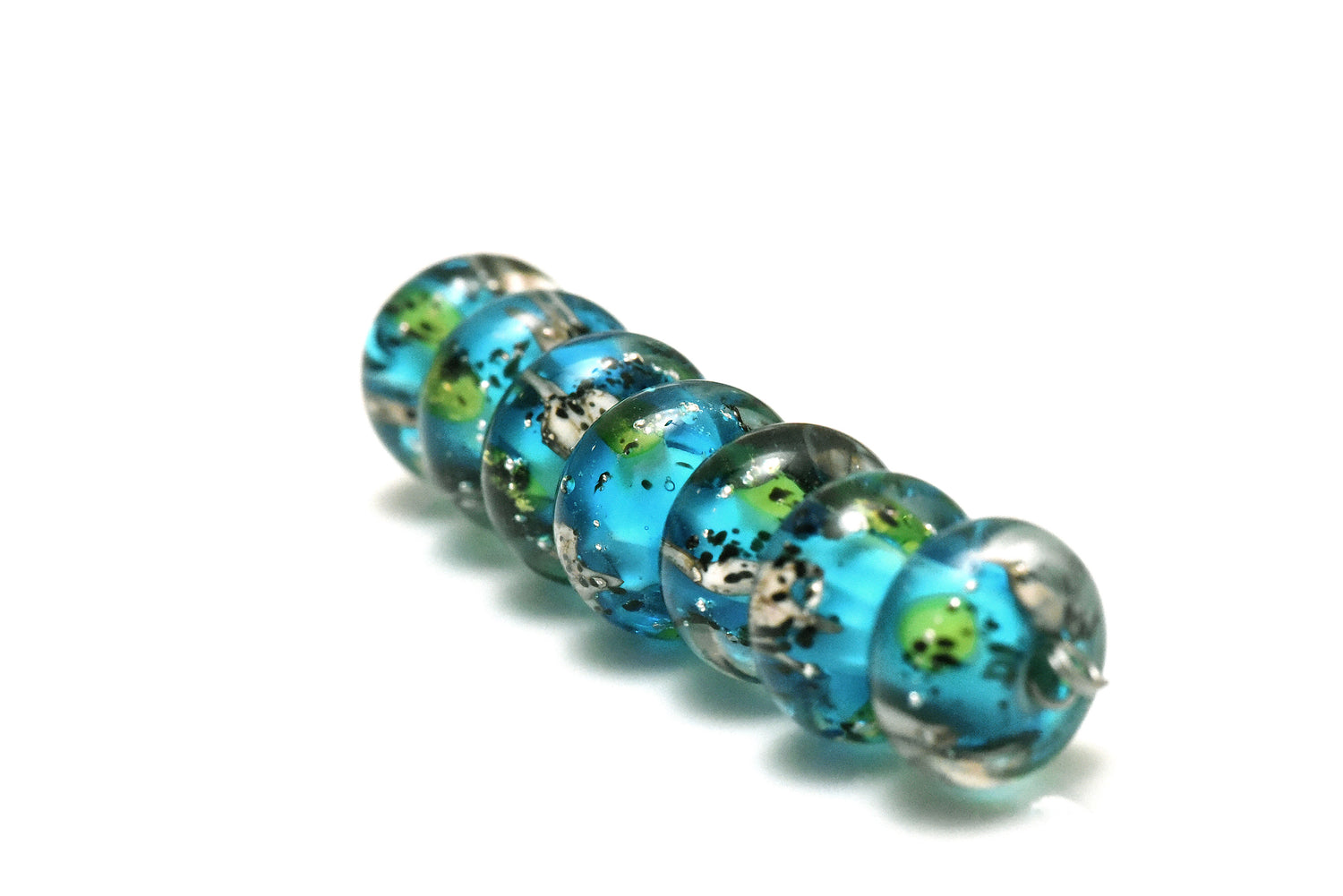 10416401 – Seven Java Moss Pond Rondelle Beads