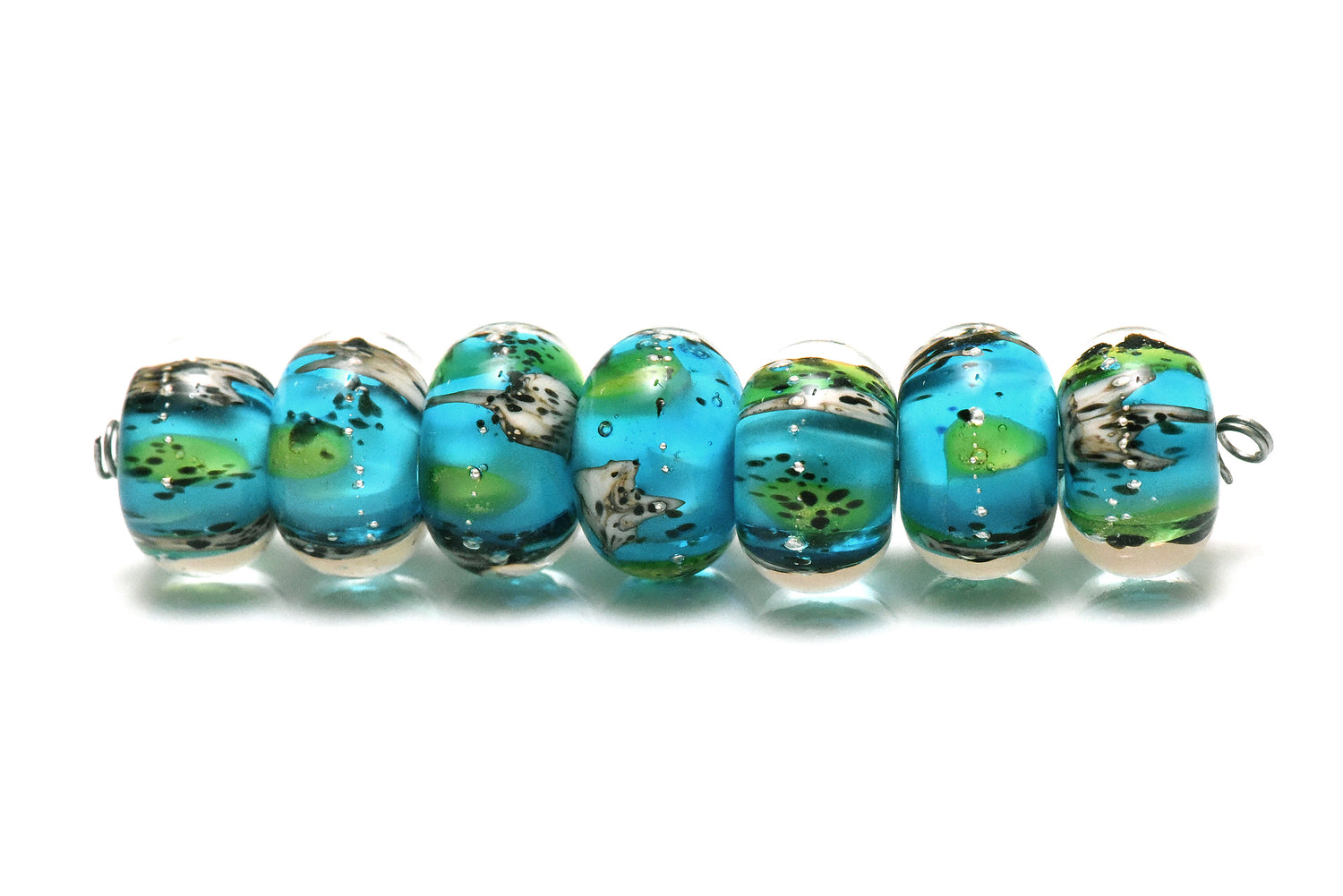 10416401 – Seven Java Moss Pond Rondelle Beads