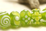 10500401 - Seven Matte-Finished Green Rondelle Beads