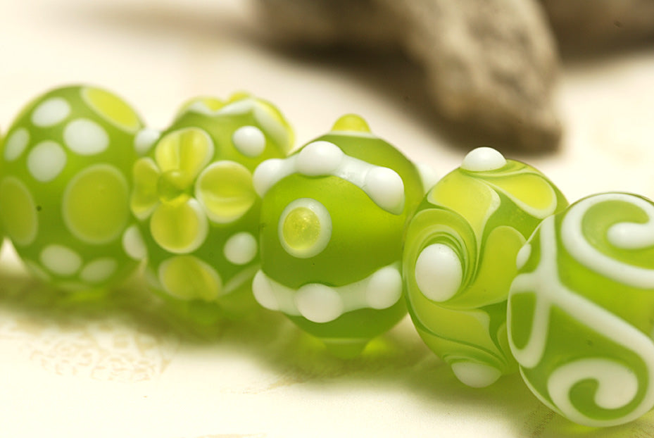 10500401 - Seven Matte-Finished Green Rondelle Beads