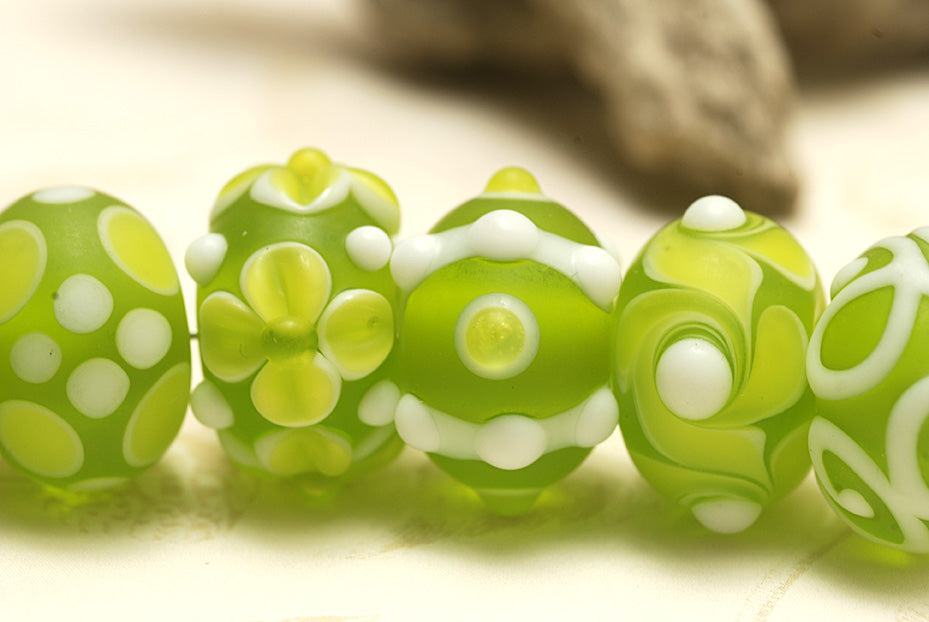 10500401 - Seven Matte-Finished Green Rondelle Beads