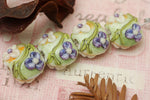 10504512 - Four White w/Purple Flora Lentil Beads