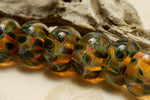 10504701 - Seven Green & Orange Rondelle Beads