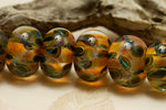 10504701 - Seven Green & Orange Rondelle Beads