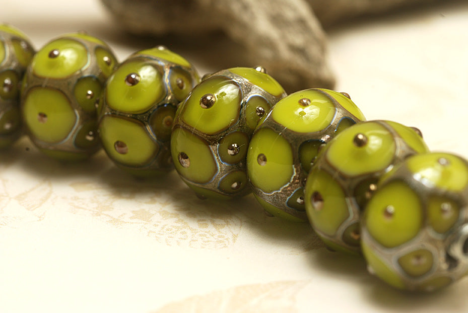 10505001 - Seven Pear Green w/Metal Dots Rondelle Beads